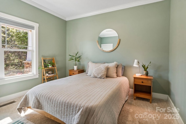 bedroom with ornamental molding and carpet flooring