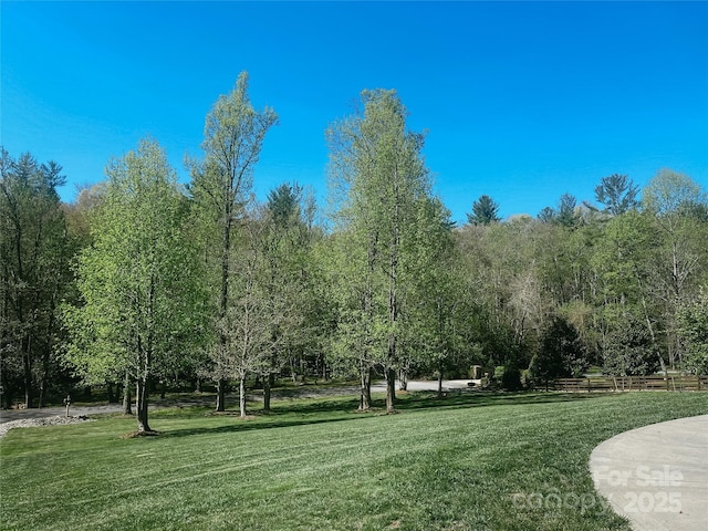 view of property's community with a lawn