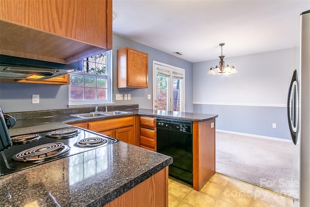 kitchen featuring stainless steel refrigerator, decorative light fixtures, dishwasher, sink, and kitchen peninsula