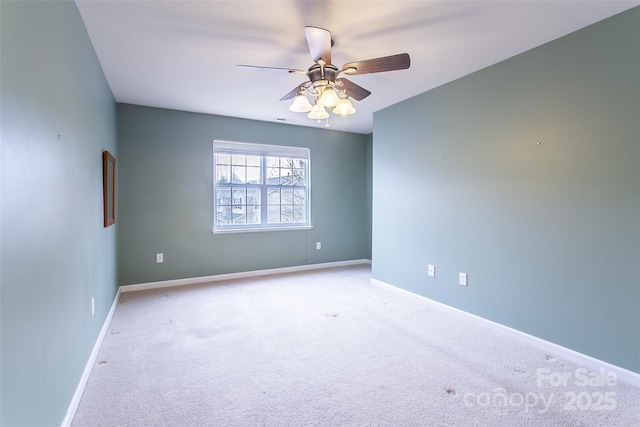 carpeted empty room with ceiling fan