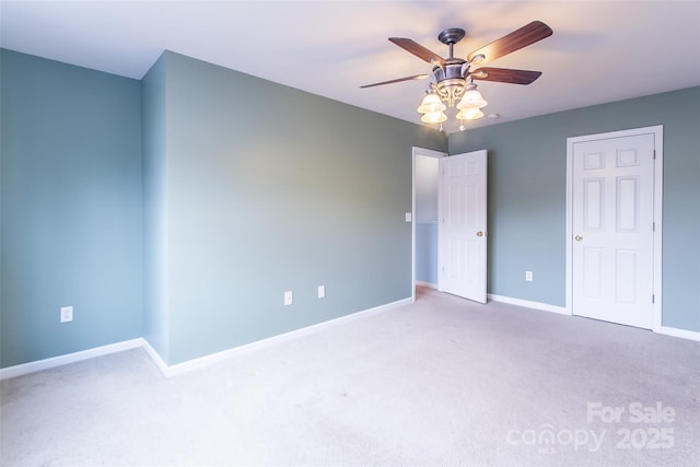 unfurnished bedroom featuring light carpet and ceiling fan