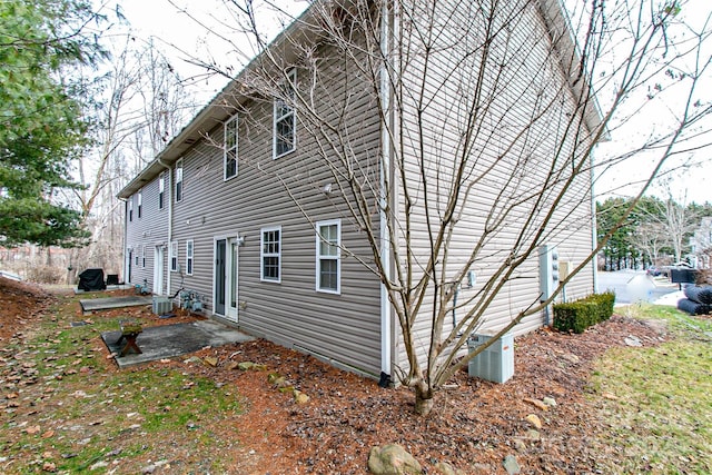 view of home's exterior featuring central AC and a patio