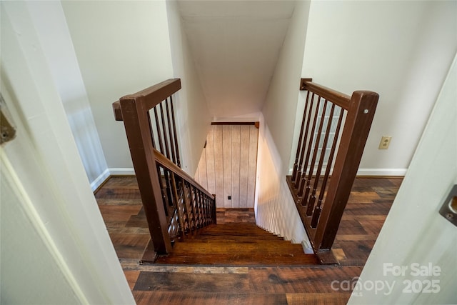 stairs featuring hardwood / wood-style flooring