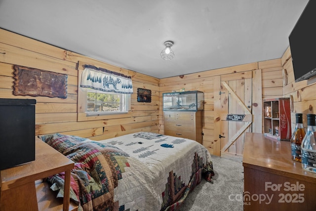 bedroom featuring carpet and wooden walls