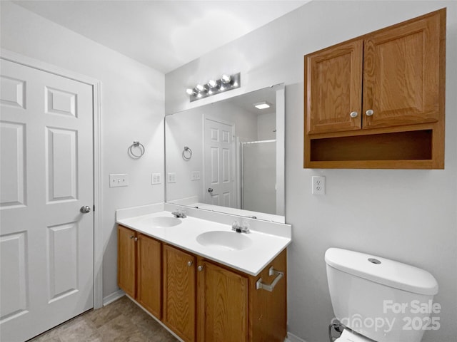 bathroom with vanity, an enclosed shower, and toilet