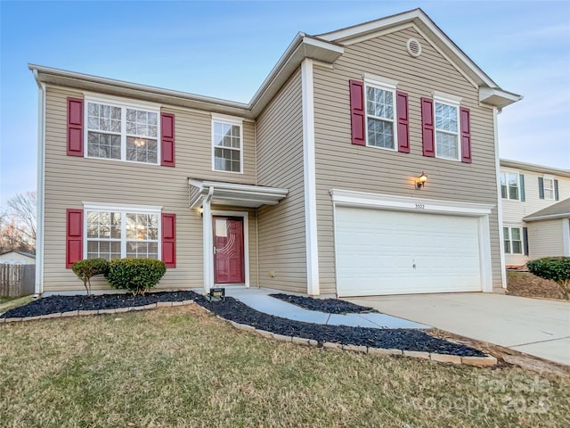 front of property featuring a garage and a front lawn