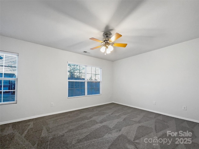 carpeted empty room with ceiling fan