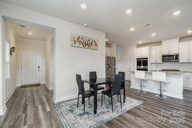 dining room with dark hardwood / wood-style floors