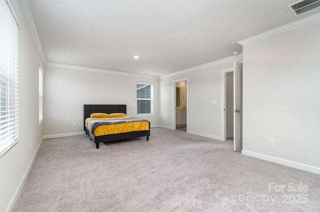 bedroom with crown molding, light colored carpet, multiple windows, and ensuite bath