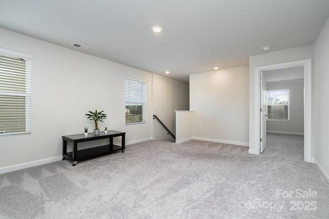 empty room featuring light colored carpet