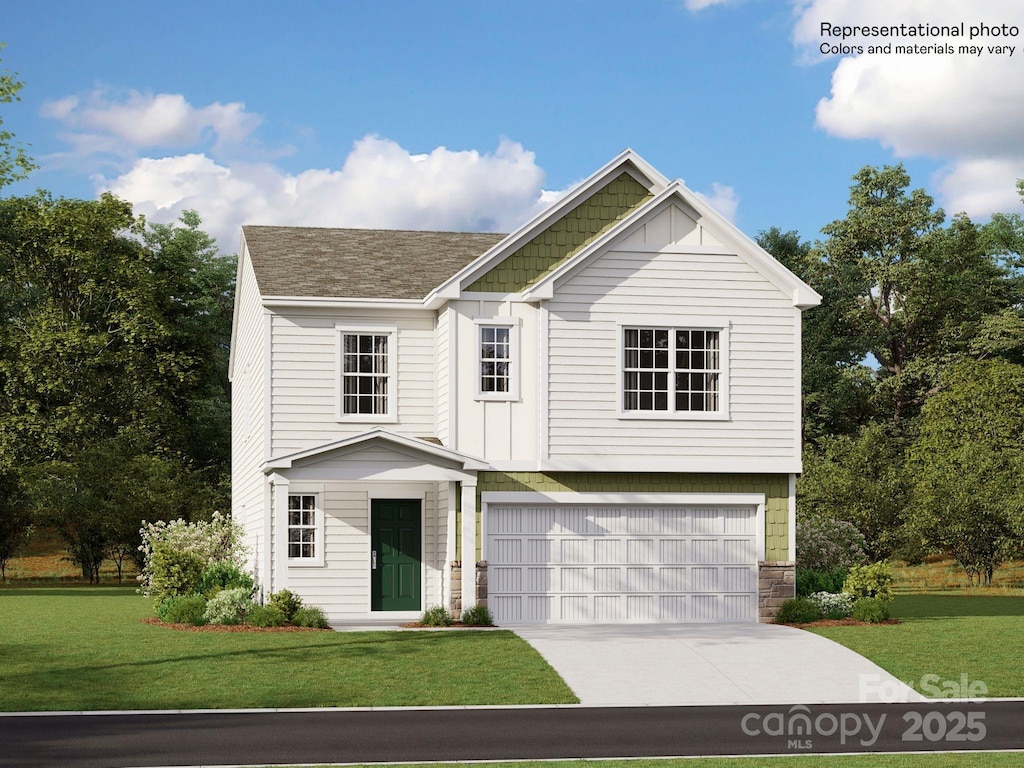 view of front facade with a garage and a front yard