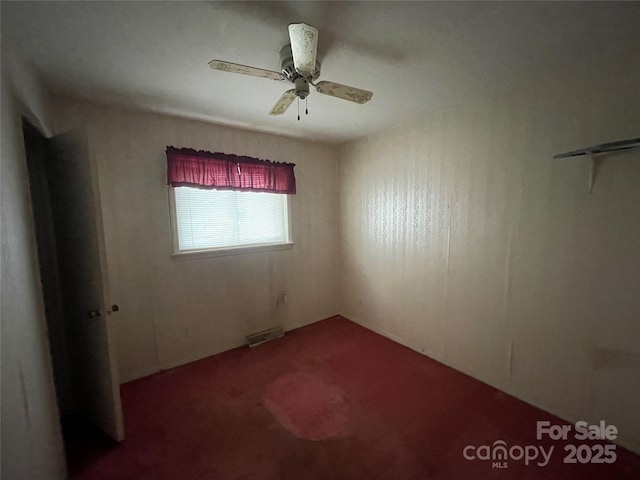 empty room featuring ceiling fan