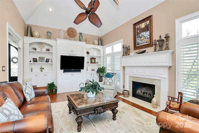 living room featuring ceiling fan and light hardwood / wood-style floors