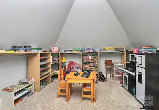 game room with lofted ceiling and carpet floors