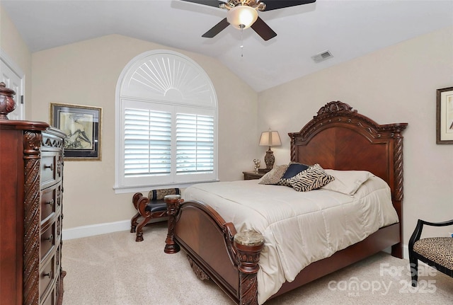 bedroom with lofted ceiling, light colored carpet, and ceiling fan