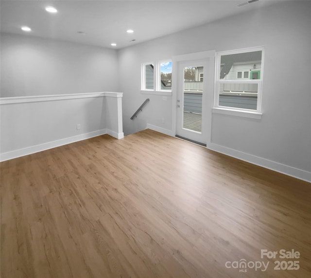 unfurnished room featuring light wood-type flooring