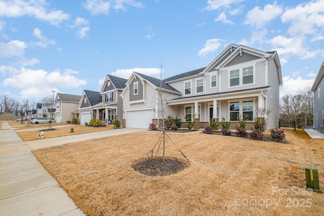 craftsman inspired home with a garage, a front yard, and a porch