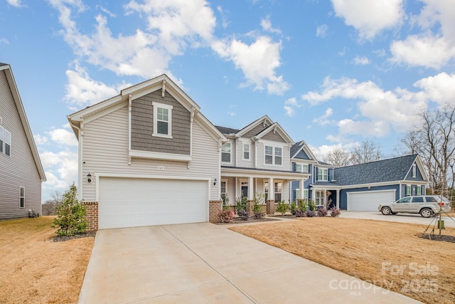 craftsman-style house featuring a garage and covered porch