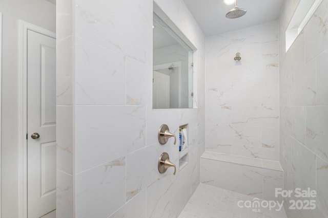 bathroom featuring a tile shower