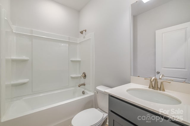 full bathroom featuring vanity, bathtub / shower combination, and toilet