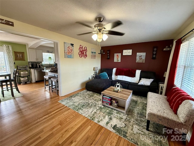 living room featuring plenty of natural light and a textured ceiling