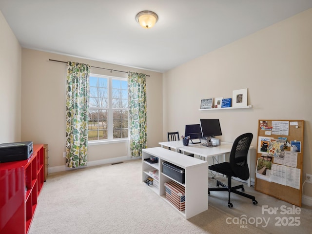 carpeted home office with visible vents and baseboards