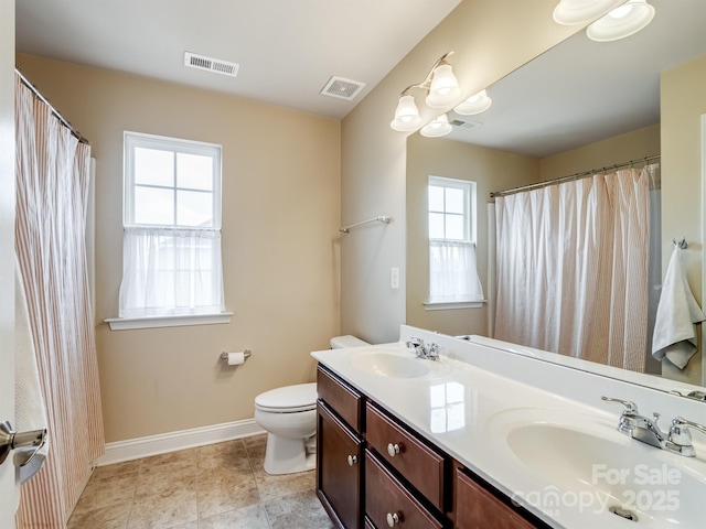 full bath with baseboards, visible vents, and a sink