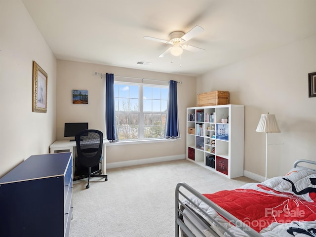 bedroom featuring baseboards, visible vents, ceiling fan, and light colored carpet