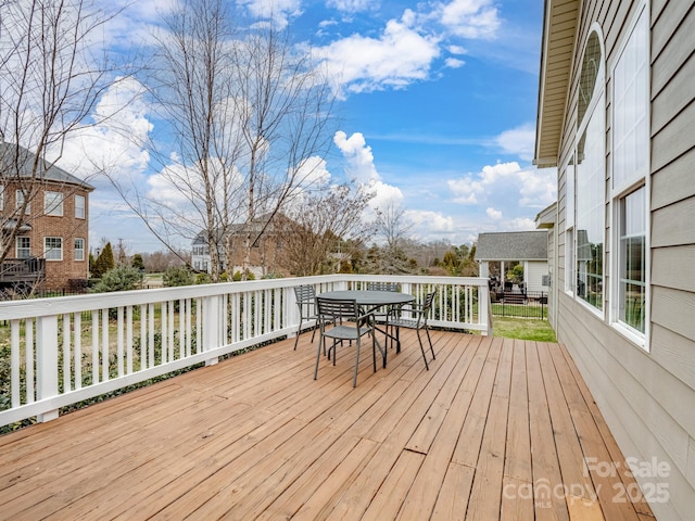 wooden deck with outdoor dining area