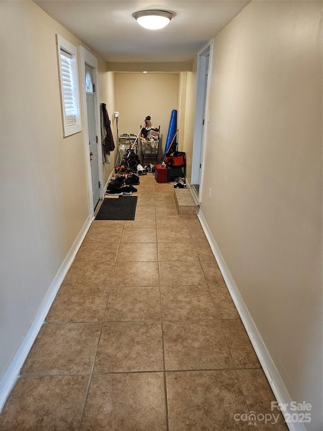 corridor with tile patterned flooring