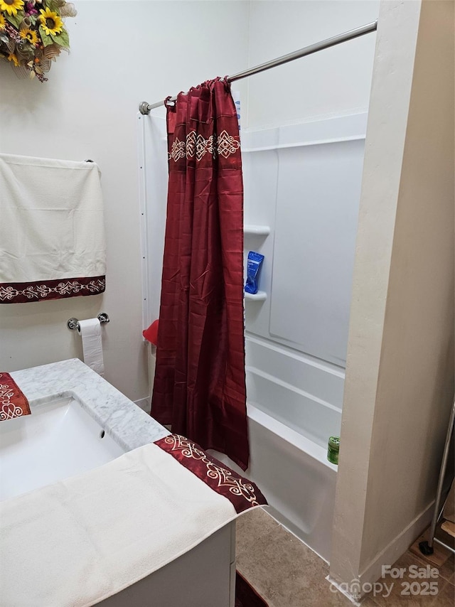 bathroom featuring vanity and shower / bath combo with shower curtain