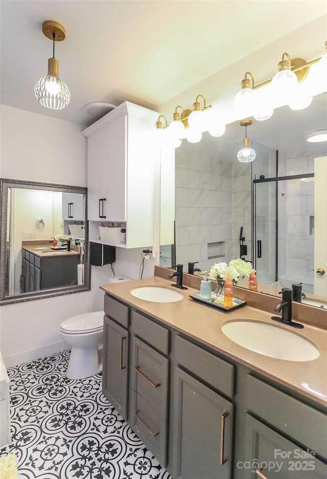 full bathroom with bath / shower combo with glass door, toilet, tile patterned flooring, and vanity