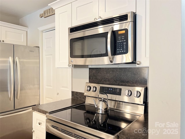 kitchen featuring white cabinets and stainless steel appliances