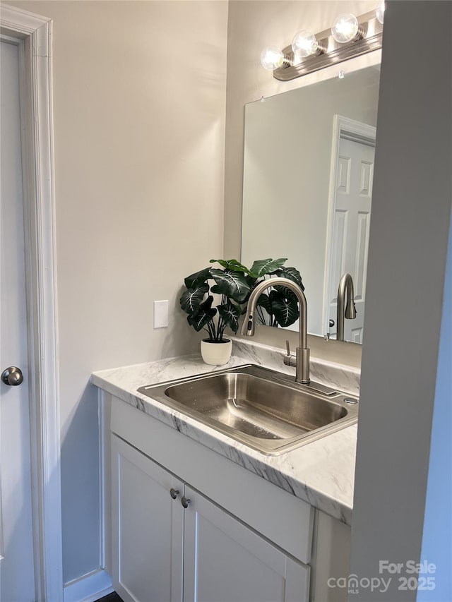 kitchen with sink and white cabinetry