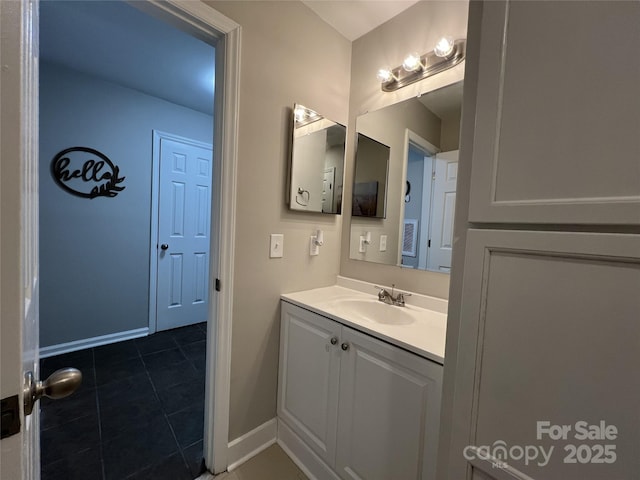 bathroom featuring tile patterned flooring and vanity