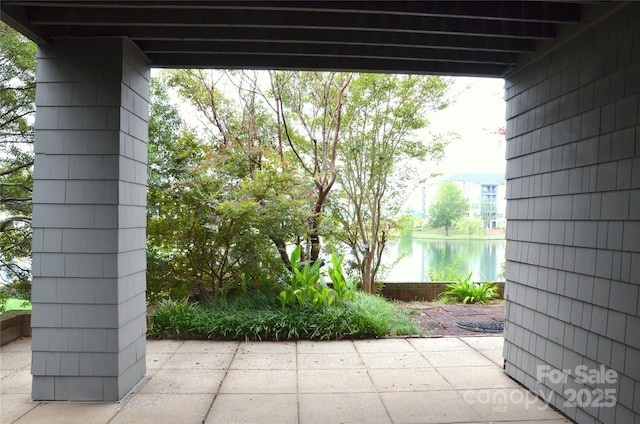 view of patio / terrace with a water view