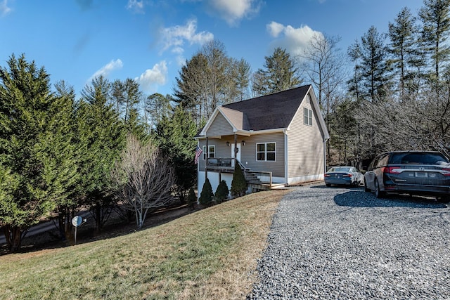 view of front of home featuring a front yard and covered porch