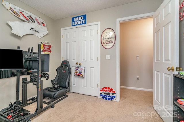 exercise room with a textured ceiling