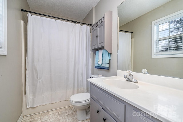 full bathroom with vanity, shower / tub combo with curtain, a textured ceiling, and toilet