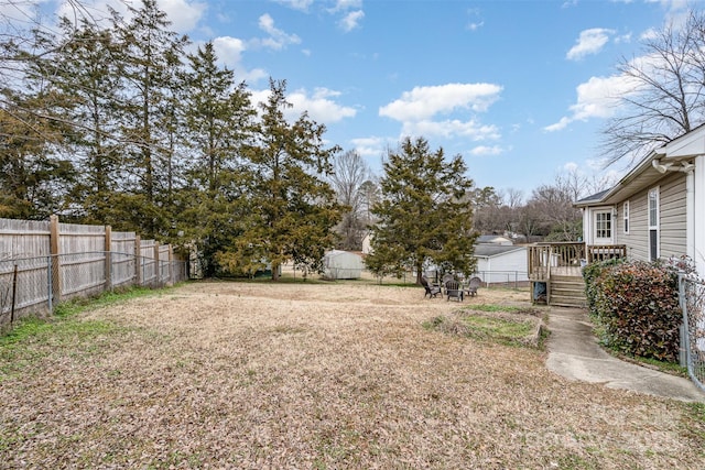 view of yard featuring a deck