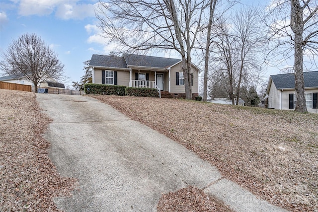 single story home with a porch