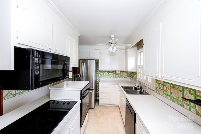 kitchen featuring white cabinetry, sink, and black appliances