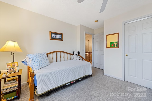 bedroom with ceiling fan and carpet flooring