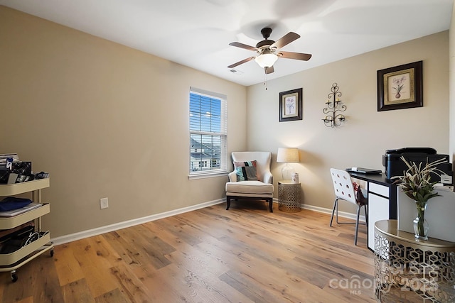 sitting room featuring ceiling fan and wood-type flooring