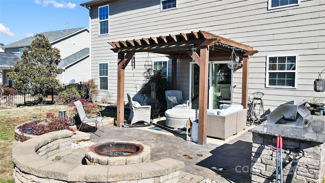 view of patio / terrace featuring a pergola, a fire pit, and grilling area