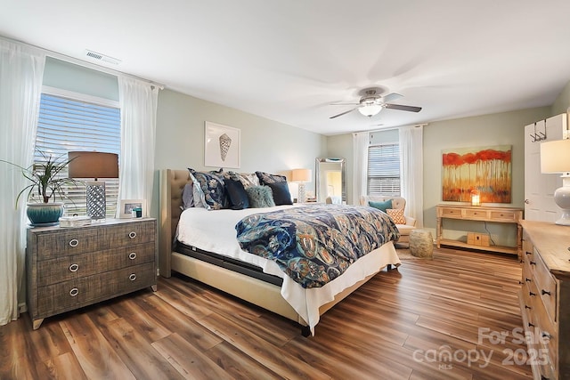 bedroom featuring dark hardwood / wood-style flooring and ceiling fan