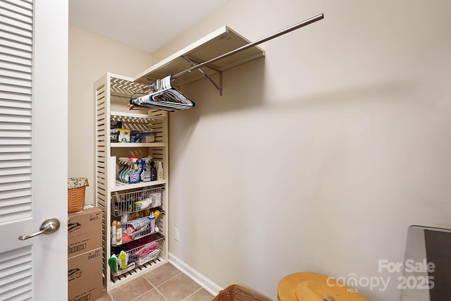 spacious closet featuring light tile patterned flooring