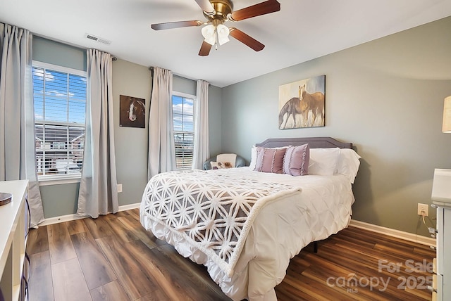 bedroom featuring dark hardwood / wood-style floors and ceiling fan