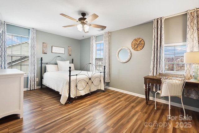 bedroom featuring dark hardwood / wood-style flooring and ceiling fan