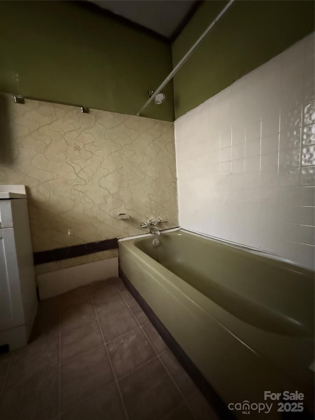 bathroom featuring tile patterned flooring and bathtub / shower combination